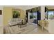 Bright living room with comfy seating and a view of the pool at 1509 Raphis Royale Blvd, Englewood, FL 34223