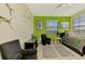 Bedroom with a full-sized bed, and green walls at 1509 Raphis Royale Blvd, Englewood, FL 34223
