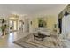 Bright living room with high ceilings, neutral decor, and large artwork at 1509 Raphis Royale Blvd, Englewood, FL 34223