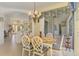Bright breakfast nook with seating for four, adjacent to the kitchen at 1509 Raphis Royale Blvd, Englewood, FL 34223