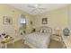 Cozy guest bedroom with window seat and neutral decor at 1509 Raphis Royale Blvd, Englewood, FL 34223