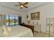 Main bedroom with water view and access to the pool area at 1509 Raphis Royale Blvd, Englewood, FL 34223