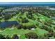 Aerial view of golf course and ocean at 1509 Raphis Royale Blvd, Englewood, FL 34223