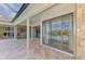 Relaxing covered patio overlooking the pool and lake at 1509 Raphis Royale Blvd, Englewood, FL 34223