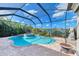Luxury screened pool and spa overlooking the lake at 1509 Raphis Royale Blvd, Englewood, FL 34223