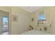 Bright bedroom with double doors leading to a patio and backyard view at 1509 Raphis Royale Blvd, Englewood, FL 34223