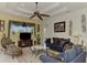 Relaxing living room with a ceiling fan and comfy seating at 1509 Raphis Royale Blvd, Englewood, FL 34223