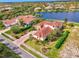 Beautiful lakefront home with stunning landscaping at 1509 Raphis Royale Blvd, Englewood, FL 34223