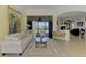 Spacious living room with access to the pool and patio area at 1509 Raphis Royale Blvd, Englewood, FL 34223