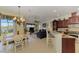 Open kitchen with granite countertops and breakfast bar at 1509 Raphis Royale Blvd, Englewood, FL 34223