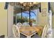 Casual dining area with pool views from sliders at 1509 Raphis Royale Blvd, Englewood, FL 34223