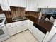 The kitchen has white cabinets, updated appliances, tile floor, and dark countertops at 1540 Glen Oaks E Dr # B336, Sarasota, FL 34232