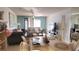 A comfortable living room with neutral-toned furniture, and a television at 1540 Glen Oaks E Dr # B336, Sarasota, FL 34232