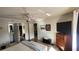 The main bedroom features a large window, dresser, and a TV at 1540 Glen Oaks E Dr # B336, Sarasota, FL 34232