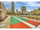 Shuffleboard court with benches and landscaping providing a relaxing outdoor activity at 1540 Glen Oaks E Dr # B336, Sarasota, FL 34232