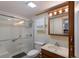 Clean bathroom with a walk-in shower and updated vanity at 1640 Center Rd, Terra Ceia, FL 34250