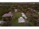 Aerial view of a house with a large backyard and waterfront access at 1640 Center Rd, Terra Ceia, FL 34250