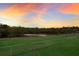 Landscaped backyard with water view and fence at 1640 Center Rd, Terra Ceia, FL 34250