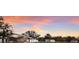 Property features covered boat storage and additional buildings at sunset at 1640 Center Rd, Terra Ceia, FL 34250