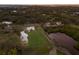 Aerial view of a house on a large lot near the water at 1640 Center Rd, Terra Ceia, FL 34250