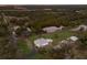 Aerial view showing a single-Gathering home with a large backyard and a waterfront view at 1640 Center Rd, Terra Ceia, FL 34250