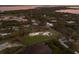 Aerial view of a waterfront property with expansive views and lush landscaping at 1640 Center Rd, Terra Ceia, FL 34250