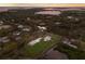 Aerial view of a house with a large backyard near the water at 1640 Center Rd, Terra Ceia, FL 34250