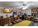 Bright bedroom with a desk setup, bookshelves, and a comfortable bed at 1640 Center Rd, Terra Ceia, FL 34250
