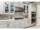 Gourmet kitchen with white cabinets, stainless steel appliances, and quartz countertops at 16435 Star Grass Cir, Bradenton, FL 34211