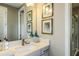 Elegant bathroom with a quartz countertop and a walk-in shower at 16435 Star Grass Cir, Bradenton, FL 34211