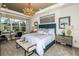 Spacious main bedroom with plush carpeting, a large window, and an ensuite bathroom at 16435 Star Grass Cir, Bradenton, FL 34211