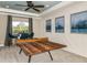 Game room featuring a ping pong table and large windows at 16435 Star Grass Cir, Bradenton, FL 34211