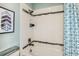 Bright bathroom with shower/tub combo and teal accents at 16435 Star Grass Cir, Bradenton, FL 34211