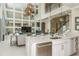 Open kitchen features a large island with quartz countertops and stainless steel appliances at 16435 Star Grass Cir, Bradenton, FL 34211
