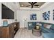 Cozy media room with sectional sofa and large flat-screen TV at 16435 Star Grass Cir, Bradenton, FL 34211