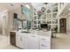 Open kitchen with large island, stainless steel appliances and breakfast bar at 16435 Star Grass Cir, Bradenton, FL 34211