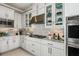 Bright kitchen with white cabinets, stainless steel appliances and a large island at 16435 Star Grass Cir, Bradenton, FL 34211