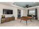 Fun game room with a ping pong table and plenty of space for entertainment at 16435 Star Grass Cir, Bradenton, FL 34211