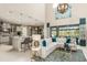 Open concept kitchen features an island and breakfast bar at 16435 Star Grass Cir, Bradenton, FL 34211