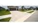 Home with a brick paved driveway at 16801 Celebration Dr, Port Charlotte, FL 33953