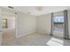 Light-filled bedroom with carpet floors and a window with gray curtains at 18122 Harwich Pl, Bradenton, FL 34202