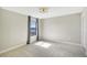 Bright bedroom featuring carpet floors and a window with gray curtains at 18122 Harwich Pl, Bradenton, FL 34202