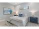 King bedroom with coastal decor and built in media console at 328 Monroe Dr, Sarasota, FL 34236