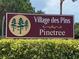Community entrance sign for Village des Pins in Pinetree at 3711 Pinecone Ct # 168, Sarasota, FL 34238