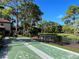 Shuffleboard court nestled within the community landscape at 3711 Pinecone Ct # 168, Sarasota, FL 34238