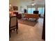 Living room with tiled floors, mustard-colored couch, and area rug at 3711 Pinecone Ct # 168, Sarasota, FL 34238
