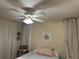 Bright bedroom with ceiling fan, comfortable bed, and decorative wall art at 3711 Pinecone Ct # 168, Sarasota, FL 34238