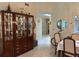 Dining area with a large hutch and view into other rooms at 3711 Pinecone Ct # 168, Sarasota, FL 34238