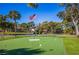 Community putting green with American flag in the background at 3711 Pinecone Ct # 168, Sarasota, FL 34238