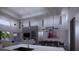Modern kitchen with island and marble countertops at 440 S Lime Ave, Sarasota, FL 34237